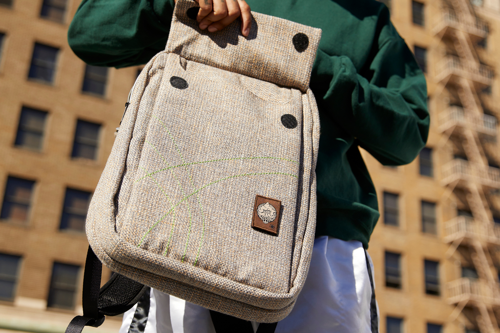 Dime Bags Slab Bag Backpack Lifestyle shot showing the front pocket velcro feature